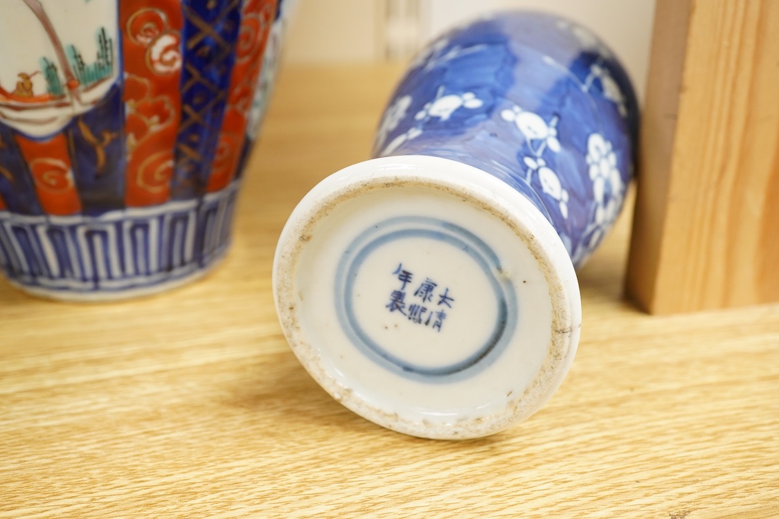An Imari vase and cover-28cm high, a Chinese jar and prunus vase and a small blue and white jar.